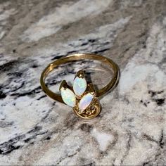 Make An Offer! This Stunning Ring Features Three Opals And A Swirl Design Set Into A 14kpg Gold Ring. Never Worn! I Believe It Is A Size 7, Will Send Measurements If Requested. *Box Shown For Display Only. This Will Not Include The Ring Box, But It Will Still Be Nicely Packaged. *Has Not Been Appraised. Ring, Jewelry, Opal, Fire Opal, Gem, Gold, 14k Gold, Promise, Gift, Birthday, Valentines, Christmas, Present, Holiday, 14kpg Fine Jewelry Gold Opal Birthstone Ring, 14k Yellow Gold Opal Ring Birthstone, Elegant 14k Gold Opal Birthstone Ring, Elegant 14k Gold Opal Ring Birthstone, Dainty Gold Opal Ring For Formal Occasions, Gift Yellow Gold Multi-stone Opal Ring, Gift Multi-stone Opal Ring In Yellow Gold, Gold Opal Jewelry With Prong Setting, Luxury Gold Opal Ring With Prong Setting