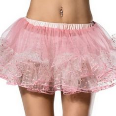 a women's pink and white tulle skirt with polka dots on the bottom