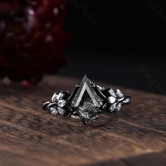 a silver ring sitting on top of a wooden table