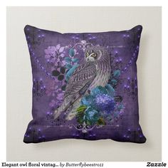 a decorative pillow with an owl and flowers on the front, in purple hues