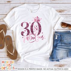 This stylish and comfortable women's t-shirt is the perfect birthday gift for any woman celebrating her 30th year. It features a classic fit and a trendy design that will surely make her feel special on her big day. Whether she's going out for a fancy dinner or celebrating with friends and family at home, this t-shirt is the perfect addition to her wardrobe and will make her feel confident and stylish. PLEASE NOTE: THIS IS A PRINTED IMAGE OF A GLITTER DESIGN. NO ACTUAL GLITTER IS USED. All items 30th Birthday Shirts For Women, Woman Celebrating, Thirtieth Birthday, Family At Home, 30th Birthday Shirts, 30 Birthday, 30th Birthday Party, Thirty Birthday, Dirty Thirty