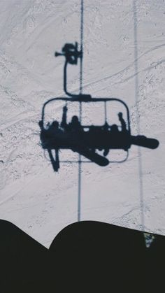 the shadow of a ski lift is shown