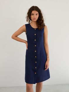 IMOGEN is a versatile sleeveless linen dress with an A-line silhouette, a button-front closure, and a knee-length cut. DETAILS - Sleeveless design - Round neckline - A-line silhouette - Button-front closure - Knee-length cut COLOR - Navy Blue (featured color) - Multiple colors available in dropdown menu above - See all color options & order fabric samples here: https://www.etsy.com/listing/586569696/linen-fabric-samples SIZING & FIT - Fits true to size - The model is wearing a size S and is 5'11 Blue Linen Dress, Sleeveless Linen Dress, Navy Blue Linen, Button Front Dress, Style Expert, Fabric Samples, Linen Dress, Cut And Color, Dress Clothes For Women