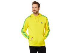 adidas Originals 3-Stripes Pullover Hoodie - Men's Clothing : Team Yellow/Bold Blue/Team Green : Kickback in relaxed comfort wearing the adidas Originals Sport Foundation Sweat Pullover Hoodie. This sweatshirt is constructed with a fixed drawstring hood, adidas logo at the front left, long sleeves with triple stripes down the arms and kangaroo pocket. Attached hood with drawstring. Long sleeves. Straight hemline. 70% cotton, 30% recycled polyester. Machine wash, line dry. Imported. Measurements: Team Green, Hoodies Men Pullover, Team Blue, Comfort Wear, Full Zip Hoodie, Adidas Logo, Product Reviews, Adidas Men, Kangaroo Pocket