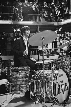 the rolling stones drummer person on drums in front of an audience