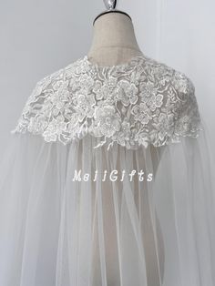 Picture Information: Color of tulle: Ivory Length:  Church 250cm-98 inches     Our length of tulle: Elbow 66cm-26 inches Fingertip 92cm-36 inches Waltz 137cm-54 inches Floor 182cm-72 inches 200cm-78 inches Chapel 230cm-90 inches Church 250cm-98 inches Cathedral 300cm-118 inches Royal 350cm-137 inches Regal 400cm-157 inches We can also Custom any length. Our color of tulle: 1. Ivory white (shown in this listing pictures)----a very light hue. Matches ivory gowns. Our most popular color option. 2. Diamond white----pure, bright white. It will look a little bit bluish. 3. Beige 4. Champagne 5. Custom other color according to my swatch It is recommended to choose carefully! Suggest getting a color swatch, just need to pay for shipping. Custom Service( extra charge ): --Custom any length, width, Wedding Dress Cape, Wedding Cape Veil, Veil Floral, Cape Veil, Cape Wedding, Dress Cape, Lace Cape, Cape Wedding Dress, Ivory Gown