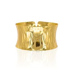 Gold-plated over brass. Adjustable. Gold Polished Cuff Bracelet, Modern Gold Hammered Cuff Bracelet, Modern Hammered Gold Cuff Bracelet, Formal Polished Brass Cuff Bracelet, Modern Gold Cuff Bracelet With Wide Band, Modern Gold Wide Band Cuff Bracelet, Polished Brass Bangle Cuff Bracelet, Polished Brass Cuff Bracelet, Gold Brass Cuff Bracelet With Wide Band