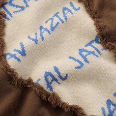 the fabric has been torn off and is brown with blue writing on it that says, wash your hands