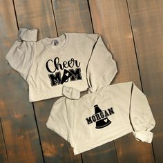 Custom Glitter or Non-Glitter Cheer Mom Sweatshirt Show your spirit with our Sparkling Cheer Mom Sweater, designed to make you shine brighter than the cheer squad :) ! *This custom shirt is handmade with professional vinyl. *Our shirts are unisex and are true to size! *In the photo's you will be able to see the custom options in regards to color that you may choose from. *We use 100% cotton shirts. The glitter material does not wash off and will last through multiple washes.  *If your shirt color is out of stock we will contact you as soon as possible to see if you would like to change shirt colors. By purchasing from us you agree to the following statements: *Due to the custom nature of this item we do not accept exchanges or refunds. *We are also not responsible for lost packages. Please Cheerleading Fan Apparel Tops For Fall, Glitter Print Crew Neck Tops For Fall, Crew Neck Top With Glitter Print For Fall, Long Sleeve Cotton Tops With Glitter Print, Fall Cheerleading Top With Letter Print, Long Sleeve Cotton Sweatshirt With Glitter Print, Cotton Glitter Print Long Sleeve Sweatshirt, Long Sleeve Graphic Print Cheerleading Top, Long Sleeve Graphic Print Tops For Cheerleading