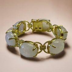 "Lower prices on our main website: https://discomarshmallow.myshopify.com/ Introducing our Sicilian Moonstone Cabochon Bracelet, a blend of history and elegance. The heart of this bracelet holds cabochon moonstones, a classic shape cherished for centuries. These stones have a rich history as they were treasured by ancient civilizations. The gold design is inspired by Sicilian ropes, adding a touch of the island's heritage. What makes this bracelet truly special is its customization. You can choo Elegant Cabochon Bracelets For Anniversary, Diamond Bracelets With Gemstone Accents, Elegant Crystal Bangle Bracelet With Natural Stones, Luxury Wedding Bracelets With Gemstone Accents, Elegant White Gemstone Bracelet, Luxury Oval Stone Bracelets, Elegant Moonstone Round Stone Jewelry, Luxury Oval Bracelets With Stones, Luxury Yellow Gold Bracelets With Stones