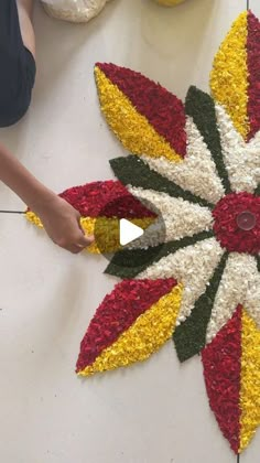 a person is working on a flower decoration