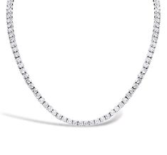 This exquisite tennis necklace features 150 dazzling diamonds, gracefully set in 14K white gold. The diamonds whirl around the necklace in a continuous loop, creating a stunning display of elegance and sparkle. Perfect for making a statement at any occasion, this necklace combines classic sophistication with modern allure. Platinum White Diamond Cut Tennis Necklace, White Platinum Tennis Necklace With Brilliant Cut, Formal White Single Strand Diamond Necklace, White Platinum Tennis Necklace With Prong Setting, White Platinum Tennis Necklace With Single Cut Diamonds, Elegant White Diamond Tennis Necklace, Timeless White Brilliant Cut Tennis Necklace, Fine Jewelry Platinum Tennis Necklace With Brilliant Cut, Timeless Platinum Tennis Necklace With Diamond Accents