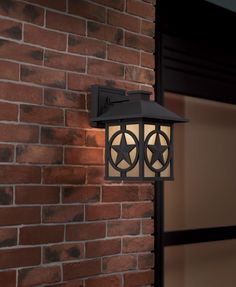 a brick wall with a light attached to it and a star on the front door