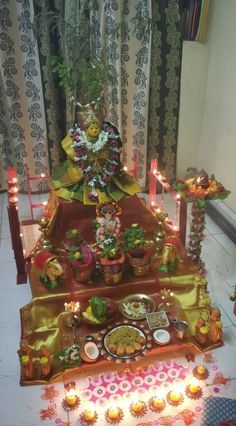 a decorated table with candles and plates on it