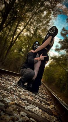 halloween costume for couple |   couple tattoos half and half Halloween Railroad Photoshoot, Couples Bourdier Photoshoot Halloween, Couples Halloween Photos, Couple Halloween Picture Ideas, Couple Spooky Photoshoot, Spooky Bodiour Couple, Spicy Halloween Photoshoot, Spooky Photoshoot Ideas Couples