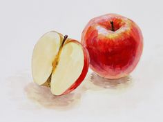 an apple is shown with one half cut in half and the other half sliced up