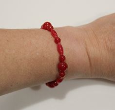 "SBR30- Dyed Red Quartz Bead Stretch Bracelet- Handmade One of a Kind Artisan Bracelet Made in the USA. Beads measure 10mm/ 6 mm and 13 x 5 mm and the bracelet is approx. 7\". Will stretch to fit most wrists. According to metaphysical practitioners, red quartz encourages positive action and produces an abundance of physical energy and vitality; because it also has many of the properties of clear quartz, it is considered a dynamic healing tool." Red Oval Beaded Bracelets For Gift, Adjustable Red Gemstone Beads Stretch Bracelet, Traditional Red Gemstone Beads Bracelet, Red Spiritual Stretch Bracelet, Red Quartz, Artisan Bracelets, Casting Jewelry, Original Jewelry, Beaded Stretch Bracelet