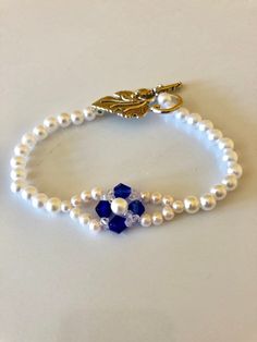 White pearls and blue and clear Swarovski crystals, hand woven. Leaf toggle closure, Also in light blue 7" each Cheap Blue Crystal Bracelet, Owl Pendant Necklace, Sea Glass Bracelet, Owl Pendant, Blue Hand, Girls Gift, Jewelry Inspo, Braided Bracelets