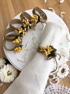 a white plate topped with flowers and napkins