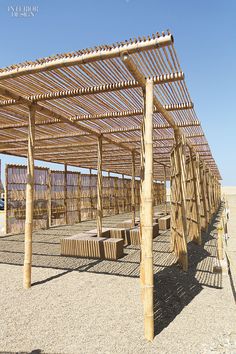 a wooden structure sitting on top of a sandy beach