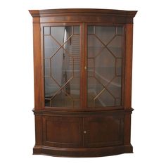 a large wooden cabinet with glass doors