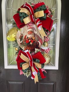 a christmas wreath hanging on the front door