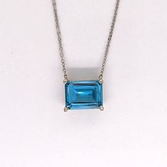 Treat yourself or someone special to a timeless symbol of sophistication and elegance with this beautiful Solitaire London Blue Topaz Pendant crafted in Solid 14k White, Yellow or Rose Gold. The 9x7mm emerald cut gemstone radiates a brilliant blue hue, perfect for November birthdays and symbolizing wisdom, loyalty, and success. Upgrade your jewelry collection with a classic piece that will last a lifetime. Elegant Emerald Cut Blue Gemstones, Elegant Blue Emerald Cut Gemstones, Classic Light Blue Emerald Cut Jewelry, Blue Emerald Cut Gemstone As Gift, Blue Emerald Cut Gemstones For Gifts, Emerald Cut Blue Gemstone For Gift, Radiant Cut Blue Topaz Jewelry, Classic Blue Topaz Gemstones As Gift, Classic Blue Topaz Gemstones For Gift