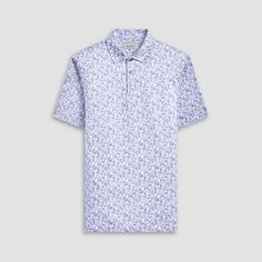 The Victor abstract print OoohCotton short-sleeved polo shirt featuring a three-button placket, mother-of-pearl buttons, and a self-fabric collar is the ideal choice for looking and feeling your best, whether you are enjoying a casual day or performing on the golf course. OoohCotton is a performance, double-mercerized, wrinkle-resistant, breathable, and easy-care cotton blend with 8-way stretch, quick-dry, and thermal comfort properties. Spring Short Sleeve Polo Shirt, White Buttoned Polo Shirt For Summer, Short Sleeve Polo Shirt For Summer Golf, Spring Short Sleeve Golf Polo Shirt, Summer Short Sleeve Polo Shirt For Golf, Spring Golf Polo Shirt With Short Sleeves, Summer Golf Shirt With Polo Collar, Collared Golf Tops For Summer, Spring Graphic Print Polo Shirt