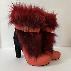 Vintage Red Pearl - MC Chunky Faux Fur High Heel Short Booties Size 38 Made in Turkey Sleek style is yours when you slip into these unique Zeyzani chunky heel boots!  This is what they mean when they say boots with the fur! So fun and so unique. Genuine Suede & Genuine Leather Upper Faux fur details upper Lined with breathe-easy genuine leather Round toe Full length zipper closure with buckle accent ¾" platform, 4" chunky heel wrapped with genuine suede Please view pictures as part of the descri Red Ankle-high Platform Boots For Parties, Red High Heel Platform Boots For Winter, Red Platform Heeled Boots For Party, Red Ankle Platform Boots For Fall, Red High Heel Platform Boots For Fall, Red High Heeled Boots For Winter, Red Block Heel Boots For Party, Bold Winter Platform Boots, Red High Heel Winter Boots