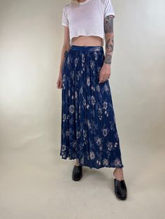 "- 90s Floral print maxi skirt  - 100% rayon - Elastic at the waist - Made in India - Tagged medium Waist: 26\" - 30\" Length: 38\" Model is 5'7, typically wears a size small and is a 26\"-27\" waist. Measurements are taken seam to seam while lying flat and are not doubled. Please refer to measurements to ensure proper fit. Due to the nature of Vintage goods there may be minor flaws or imperfections. These add to the beauty and uniqueness of each item. All sales are final. When you are ready to purchase please read our shop policies." Blue Rayon Maxi Skirt For Spring, Blue Rayon Maxi Skirt, Blue Rayon Bottoms For Spring, Blue Flowy Rayon Maxi Skirt, Spring Rayon Blue Bottoms, Summer Pleated Maxi Bottoms, Casual Pleated Maxi Bottoms, Summer Maxi Length Pleated Bottoms, Summer Pleated Maxi Length Bottoms