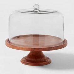 a wooden base under a glass dome on a white background with clipping for text