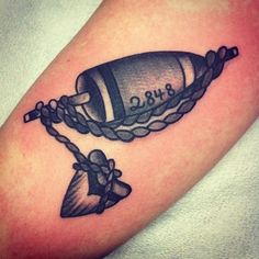 a tattoo with a bell and chain on it