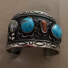 Navajo Sterling Silver Turquoise & Coral Vintage Cuff Bracelet Southwestern Blue Cuff Jewelry, Southwestern Style Blue Bangle Bracelets, Southwestern Style Blue Bangle Bracelet, Blue Artisan Cuff Jewelry, Artisan Blue Cuff Jewelry, Blue Multi-stone Bangle Jewelry, Blue Multi-stone Bangle, Southwestern Blue Cuff Bracelet As Gift, Artisan Blue Cuff Bangle Bracelet