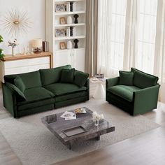 a living room with two green couches and a coffee table