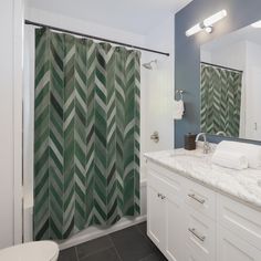 a bathroom with green and white shower curtain