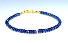 This is a beautiful blue Sapphire gemstone bracelet The sparkling gemstones are a sky blue with facets that catch the light beautifully. The precious stones are a very good quality Blue gemstone, bracelet made from natural faceted blue sapphire beads , elegant and precious The Sapphire rondelles are strung on the highest quality metal strand beading wire,which is extremely strong and flexible. The natural blue Sapphire measure 3 OT 4 mm approximately You'll receive this exact item as shown in the photos above. Adjustable Sapphire Bracelets With Gemstone Beads, Adjustable Sapphire Bracelet With Gemstone Beads, Adjustable Sapphire Beaded Bracelets With Gemstones, Blue Rondelle Beaded Bracelets With Polished Beads, Elegant Sapphire Faceted Bracelets, Elegant Sapphire Bracelets With Faceted Beads, Elegant Sapphire Bracelet With Faceted Beads, Adjustable Faceted Sapphire Bracelets, Elegant Blue Rondelle Bracelets