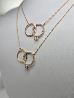 Celebrate your love and commitment with this beautiful 14k gold promise ring necklace. Featuring two interlocking circles, this delicate pendant symbolizes the eternal bond between two people. Stones around one of the rings and and center white stone representing the promise between you and your special one. The necklace is available in both yellow and rose gold, allowing you to choose the perfect metal to match your personal style. This necklace is 16 inch with an adjustable 1 inch link to make it 18 inch.  Key features: 14k gold solid (yellow or rose gold) Interlocking circle pendant Adjustable chain length for a personalized fit Perfect for expressing love, friendship, or commitment This elegant necklace is a thoughtful and meaningful gift for any special occasion. Whether you're celebr Gold Promise Ring, Expressing Love, Delicate Pendant, Wedding Ring Necklaces, Gold Promise Rings, Yellow Gold Necklace, Elegant Necklace, Elegant Necklaces, Circle Pendant