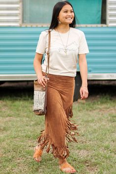 Brown Fringe Asymmetric Wrap Suede Midi Skirt Asymmetrical Spring Festival Skirt, Asymmetrical Skirt For Spring Festivals, Spring Festival Asymmetrical Skirt, Casual Asymmetrical Festival Skirt, Bohemian Asymmetrical Maxi Skirt For Fall, Bohemian Asymmetrical Skirt For Fall, Asymmetrical Wrap Skirt For Spring Festival, Casual Asymmetrical Maxi Skirt For Fall, Casual Asymmetrical Relaxed Skirt