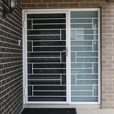 the front door to a building with glass panels