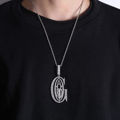 Our Goyard Pendant is one of the sleekest and stylist pendants of the Rapper Tyga G. Get iced out like him with this inspired Goyard Pendant from Tyga G. White Gold Plated: 5x PVD Plating & VVS CZ Stones PREMIUM Quality: Hand Set Diamonds No form of discomfort on your skin Free 24 inch Rope Chain included Size: Lenght: 73mm / 2.87 inch | Width: 36mm / 1.42 inch | Weight: 20g FREE STANDARD SHIPPING White Bling Necklaces For Streetwear, White Pendant Necklace For Streetwear, White Iced Out Round Pendant Necklace, Iced Out White Round Pendant Necklace, Silver Iced Out Round Pendant Necklace, Iced Out Silver Round Pendant Necklace, The Rap Game, Men Jewelry, Cuban Chain