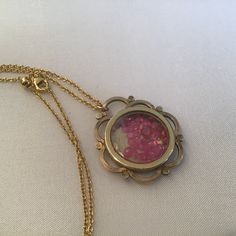 "Antique Art Nouveau Guilloche Locket filled with rubies. The gemstones move freely in the double-sided locket. The precious gems are gorgeous and beautiful quality. I meticulously search the world for the best quality and price. The gold-plated Guilloche round locket is from the early 1900's and a Gorgeous statement piece. It has a diameter of approx. 1 1/8\" and sparkles with rubies! It hangs from a 18\" gold-plate chain that extenders to 30\". It will come to you in a gift box. The Perfect gi Heirloom Brass Necklace For Keepsake, Gold Pendant Locket Necklace With Birthstone, Yellow Gold Brass Jewelry With Birthstone, Yellow Gold Birthstone Brass Jewelry, Yellow Gold Birthstone Jewelry In Brass, Yellow Gold Brass Necklace For Keepsake, Round Brass Birthstone Jewelry, Yellow Gold Medallion Jewelry With Birthstone, Unique Yellow Gold Birthstone Jewelry