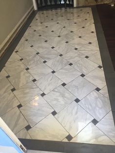 a white and black tiled floor in a room