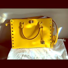 Yellow Crossbody With Gold Buttons Yellow Rectangular Bag With Branded Hardware, Yellow Rectangular Bags With Branded Hardware, Yellow Shoulder Bag With Branded Hardware, Yellow Shoulder Bag With Branded Hardware For Travel, Yellow Travel Bag With Branded Hardware, Yellow Leather Shoulder Bag With Branded Hardware, Yellow Crossbody Bag With Branded Hardware, Summer Everyday Shoulder Bag With Branded Hardware, Summer Shopping Bags With Branded Hardware