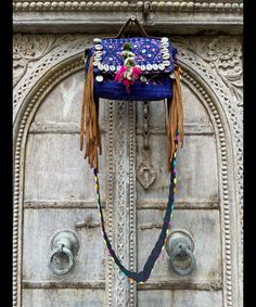 About bag  Indo-gypsy fusion, everyday use hand bag made from Banjara fabrics sourced from Vintage tribal costumes of regions of Rajastan and Gujarat. These are embellished with light catching coins, and intricate bead work tassels. Size - length 15 inches/ width 21 inches Company details:  Company name: Houseoftextile  Contact number: +919784447473  Email id: houseoftextile77@gmail.com  Shipping & custom : Delivery through one of the finest service providers : Skyway, Fedex, UPS  And DHL. Any l Traditional Blue Bags For Festivals, Traditional Blue Shoulder Bag For Festivals, Bohemian Blue Embroidered Shoulder Bag, Bohemian Blue Shoulder Bag For Festivals, Handmade Blue Shoulder Bag For Festivals, Blue Rectangular Shoulder Bag For Festivals, Bohemian Hand-stitched Bags, Traditional Handmade Blue Shoulder Bag, Blue Embroidered Bag For Festivals