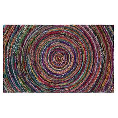 a multicolored rug with an oval design