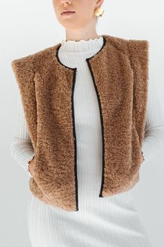 STYLE + FIT NOTES: Stay cozy + stylish with the Tucker Sherpa Vest. Featuring a soft sherpa detail + a cropped fit, this vest is perfect for layering over your favorite dress or wearing on its own. With endless possibilities for styling, you'll love adding this unique piece to your wardrobe. This sherpa delight runs true to size. Sherpa Vest, Stay Cozy, Favorite Dress, Endless Possibilities, Hair Jewelry, Unique Pieces, Layering, Velvet, Wardrobe