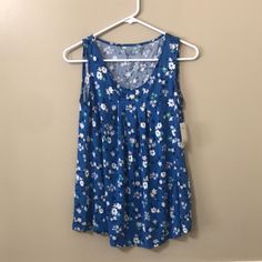 Croft & Barrow Blue Floral Sleeveless Top New With Tags Size Small Blue With Floral Print Sleeveless Front Pleats 95% Rayon 5% Spandex Blue Sleeveless Floral Print Top, Printed Cotton Blue Tank Top, Blue Sleeveless Sleepwear With Built-in Bra, Blue Floral Print Camisole Tank Top, Blue Sleeveless 4-way Stretch Tank Top, Floral Sleeveless Top, Croft & Barrow, Floral Sleeveless, Blue Floral