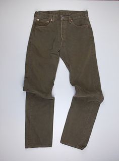 Vintage Levi's 501 brown twill pants. Button fly closure. 100% cotton. Made in USA. In good vintage condition.  Tagged W 33; L 34 Actual measurements: waist 32", rise 11 1/2", inseam 33" Classic Brown Straight Bottoms, Brown Cotton Jeans With Straight Hem, Brown Straight Cotton Bottoms, Brown Cotton Straight Bottoms, Brown Straight Cotton Pants, Brown Straight Leg Pants With Button Closure, Straight Selvedge Cotton Pants, Vintage Brown Jeans With Five Pockets, Vintage Brown Pants With Five Pockets