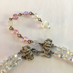 "This gorgeous vintage signed Hobe two strand necklace features alternating aurora borealis and pink crystal beads - all chain strung to ensure that this classic piece will last for years. Perfect for a special occasion, both portions of the silver tone clasp display the Hobé signature. SIZE/CONDITION: In excellent condition, this necklace is 20\" long (from hook to terminal bead) and can be adjusted down to 3-4\" using the adjustment chain. A small portion of each of the chains on which the bea Choker Silver, 60s Vintage, Animal Brooch, Pearl Cream, Beaded Choker, Vintage Costume Jewelry, Pink Crystal, Strand Necklace, Aurora Borealis