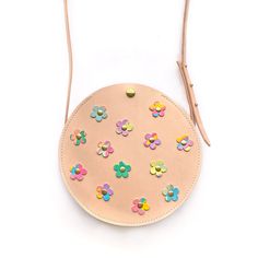 Our fun-loving leather Bloom Around Town bag is sure to add a little pep to your step. Adorned with daisies in your choice of colorful leather, it's perfect for every occasion. Follow along @gladadnyoungstudio. Summer Gift Leather Bags, Summer Leather Bag For Gift, Summer Leather Bags For Gifts, Spring Gift Leather Shoulder Bag, Spring Leather Bags With Round Handle, Spring Leather Shoulder Bag Gift, Spring Leather Shoulder Bag For Gift, Leather Bags With Round Handle For Spring, Leather Shoulder Bag With Round Handle For Spring